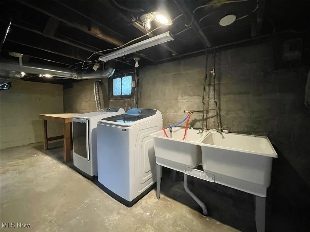 Newer double utility tub, and the washer and dryer stay!