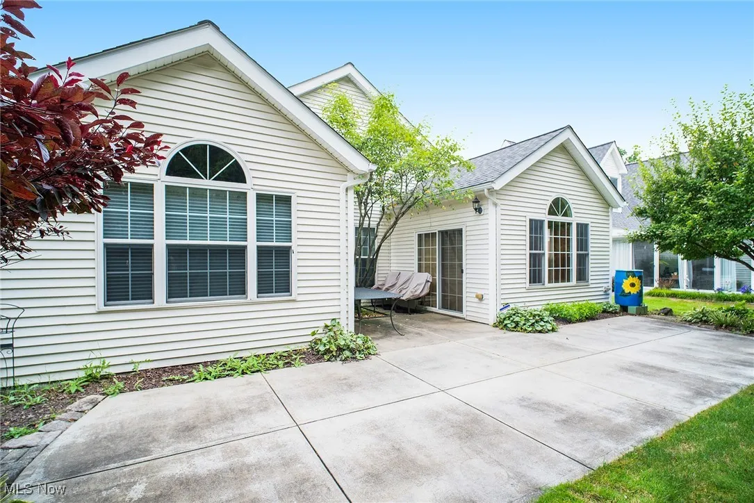 Rear view of property featuring a patio area