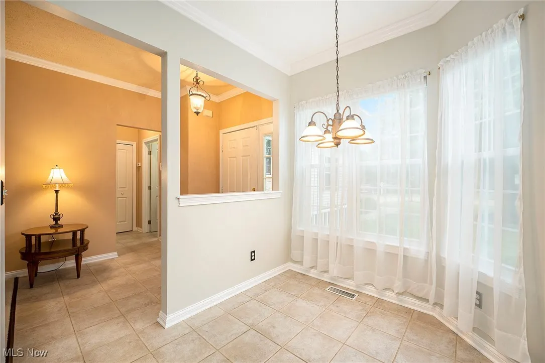 Off foyer - hall leads to laundry/utility room to garage