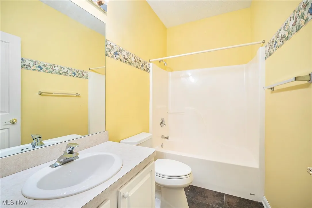 Second Full bathroom with vanity and shower / washtub combination