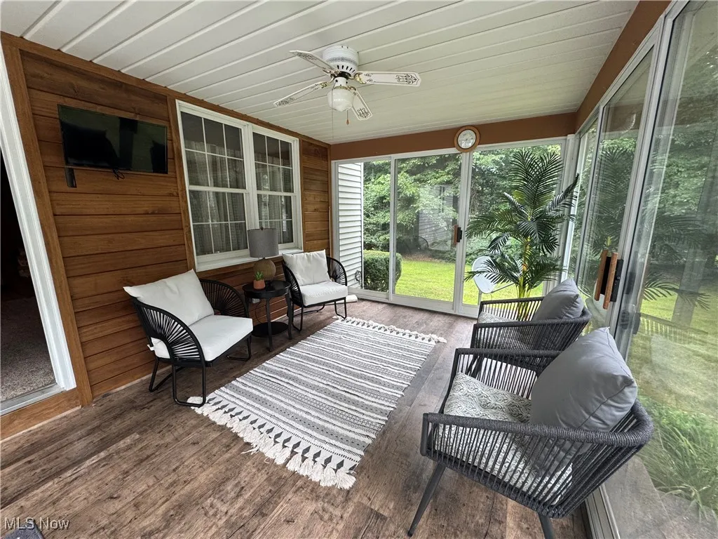 Sunroom with a ceiling fan