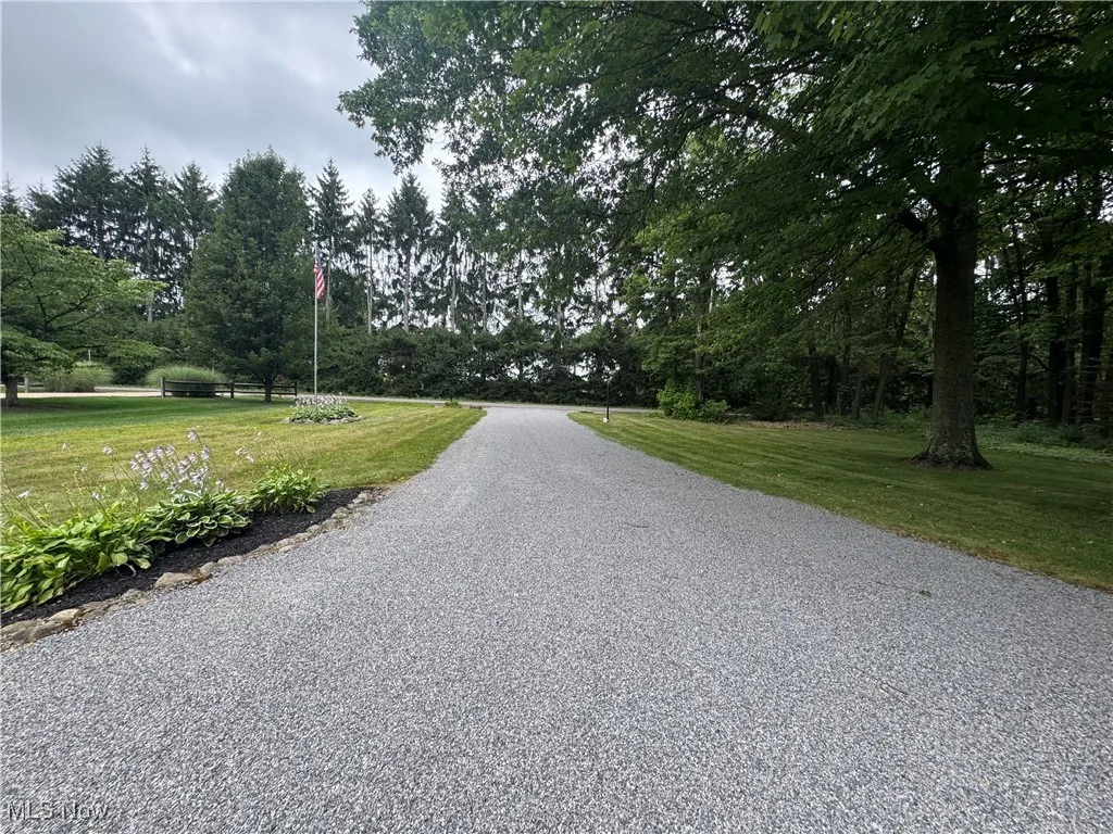 Driveway, yard with flag pole