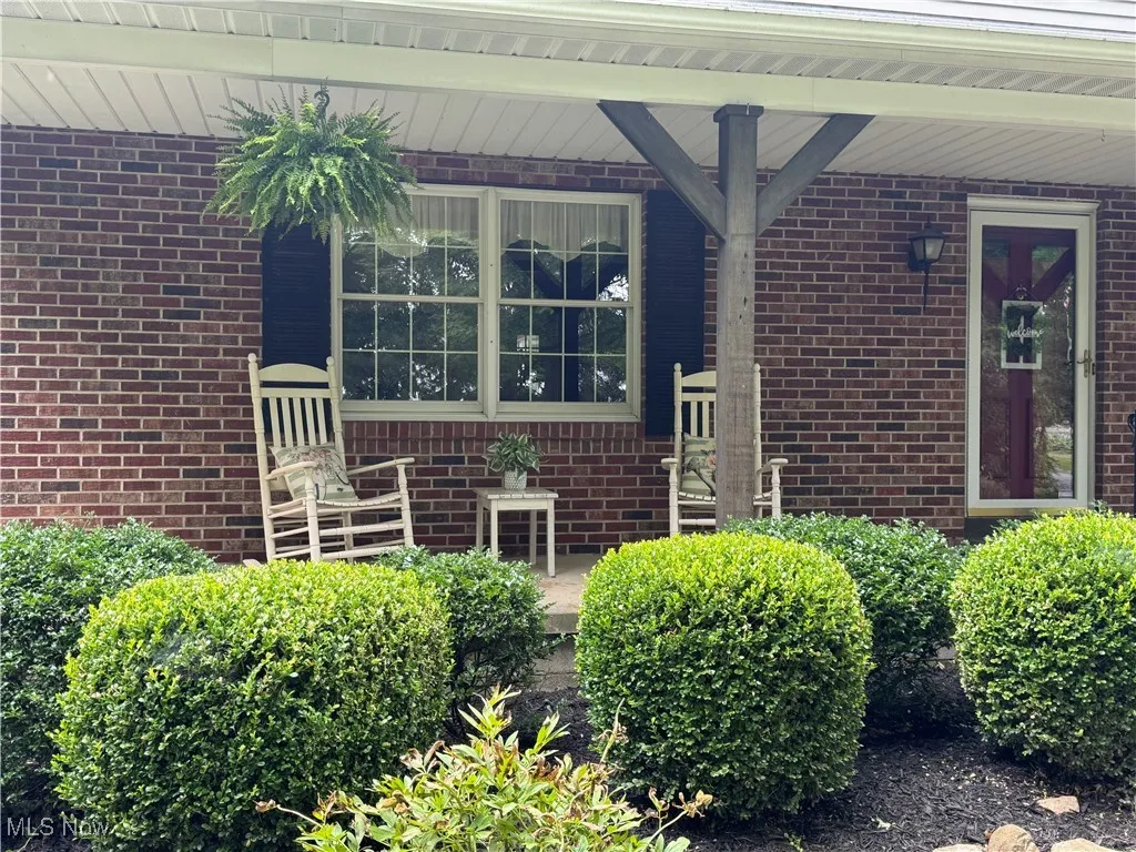 Doorway to property with brick siding