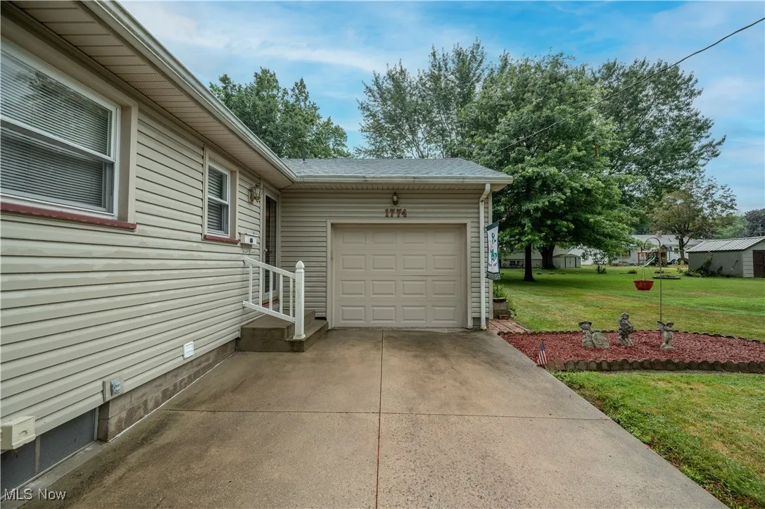 Garage featuring driveway