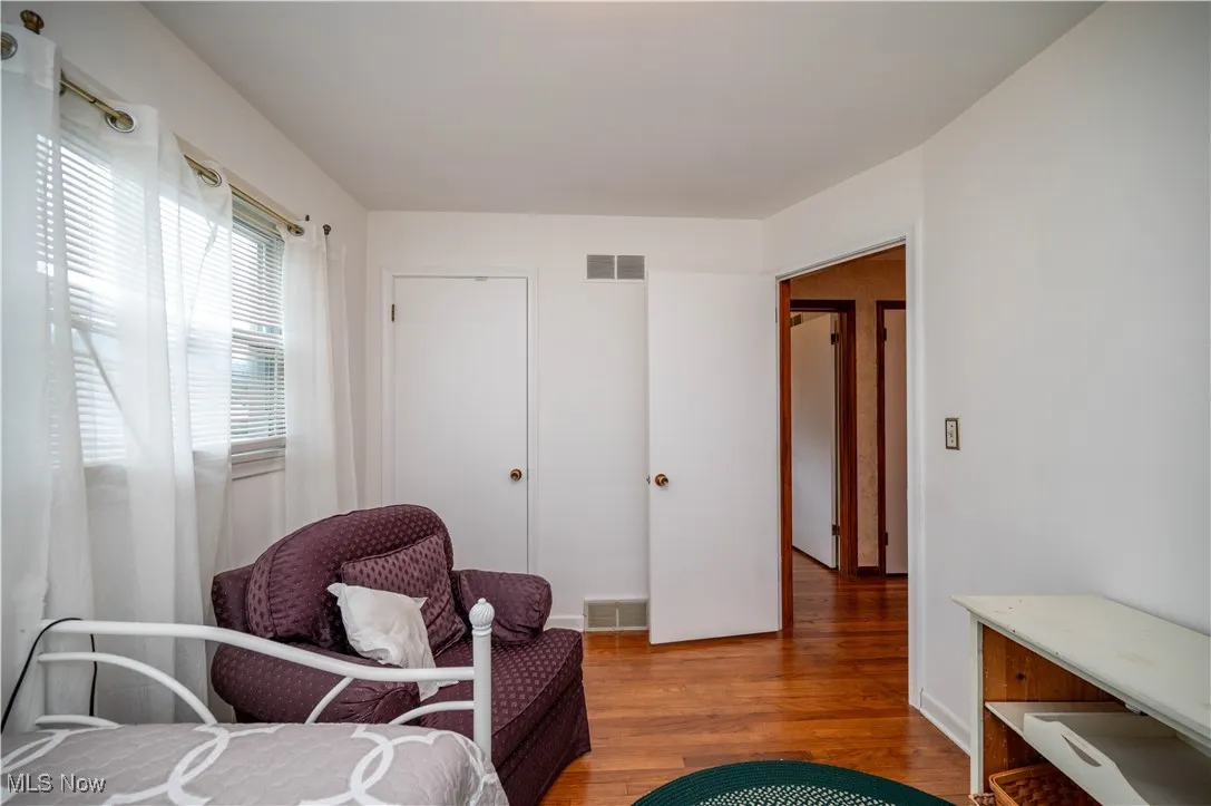 Bedroom with wood finished floors
