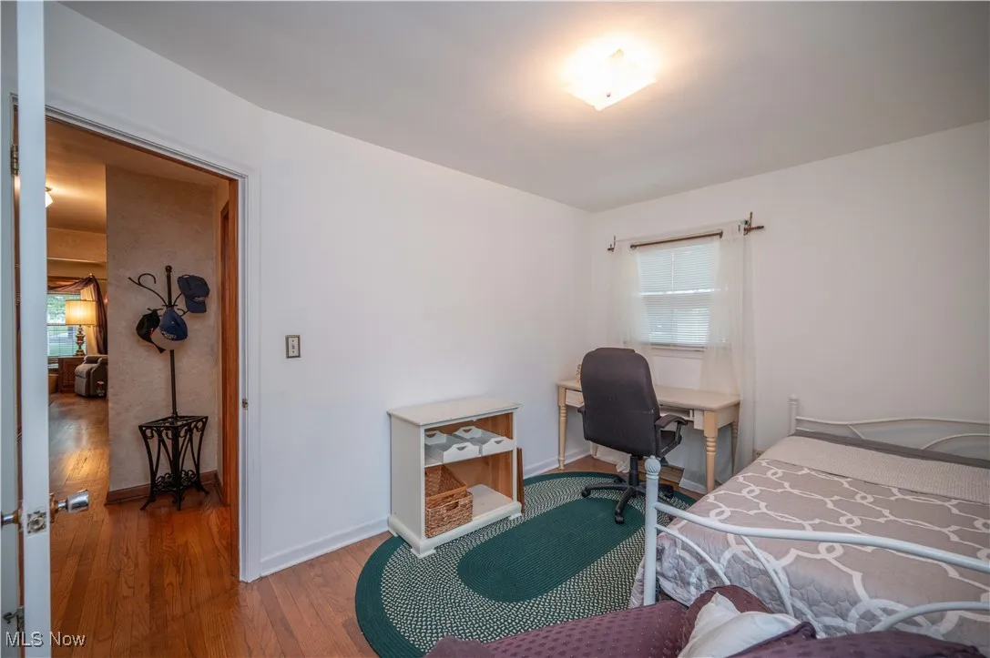 Bedroom featuring hardwood flooring