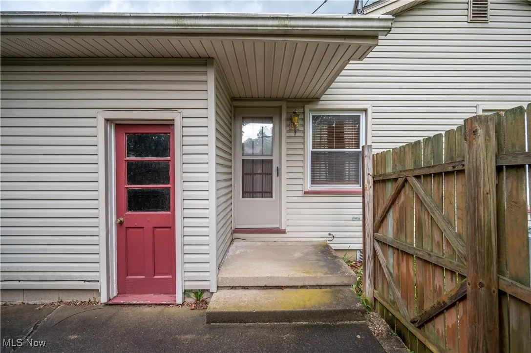 Back entrance to property from attached garage and from eat-in kitchen