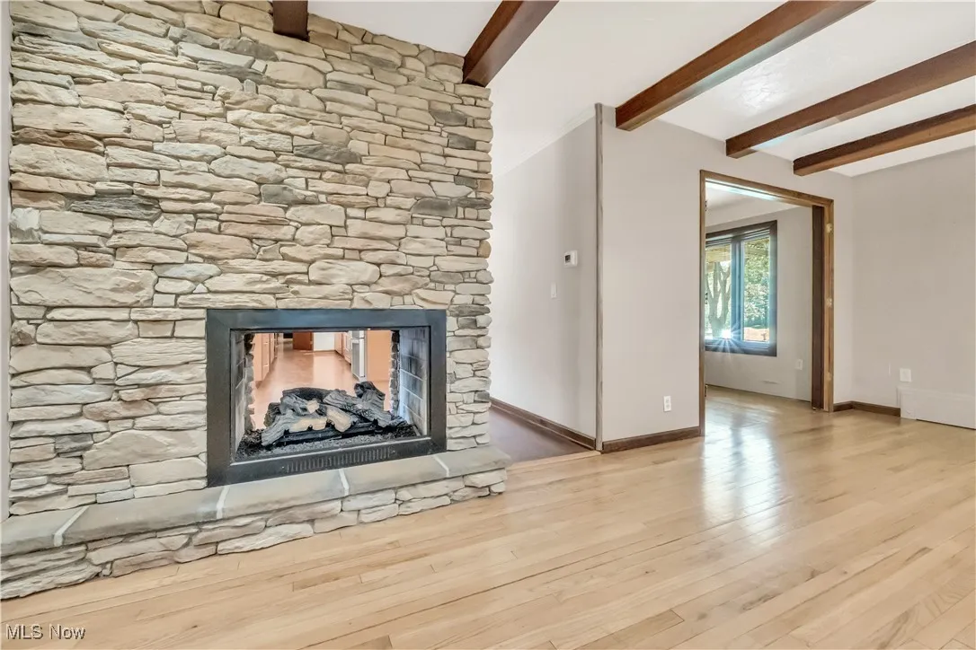 Shared see-through fireplace with eat-in-kitchen / breakfast nook area