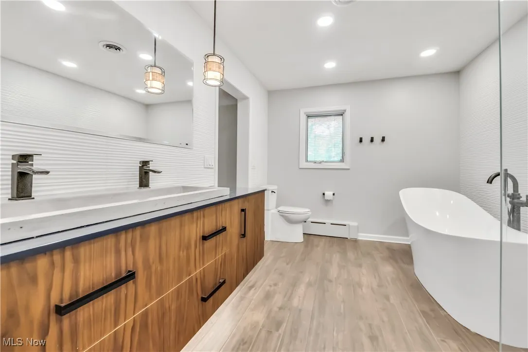 Very spacious shower with multiple shower heads