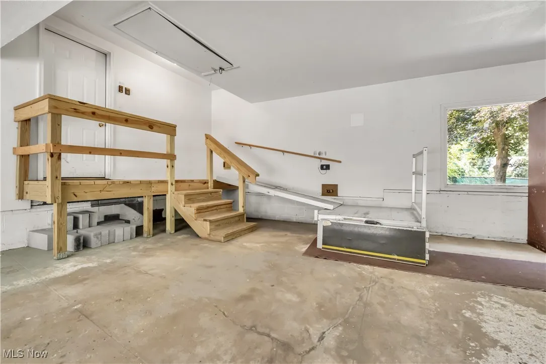 Foldable ramp in the garage to allow for full access to the home for wheelchairs and can be adjusted for full functionality of the parking spaces inside the garage
