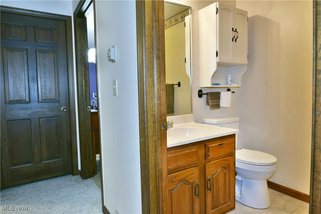Bathroom featuring toilet and vanity