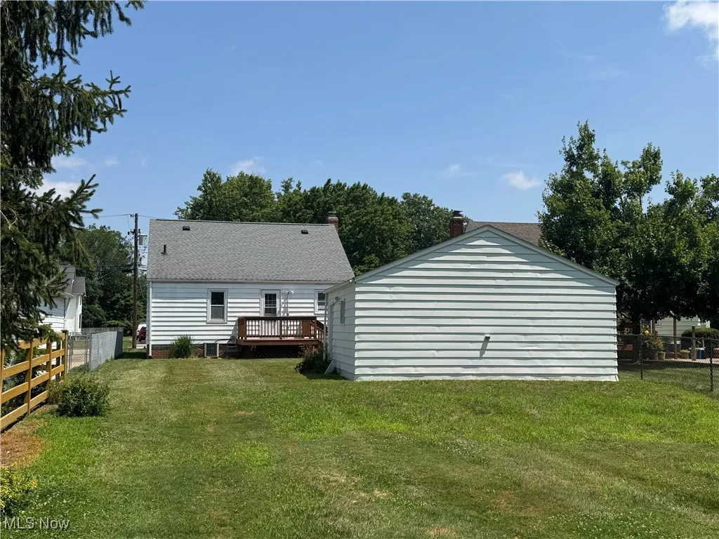Back of house with a wooden deck