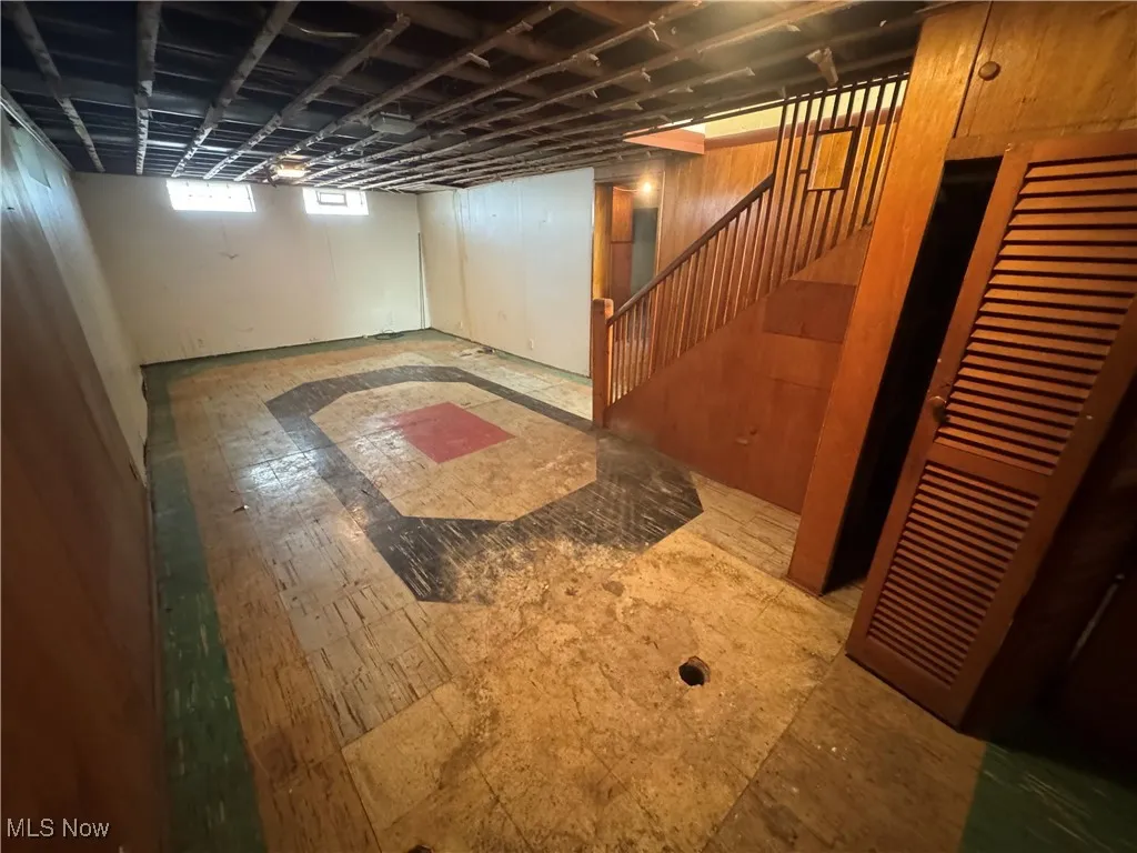 Basement featuring stairway