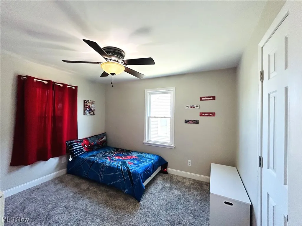 Bedroom with carpet floors and ceiling fan