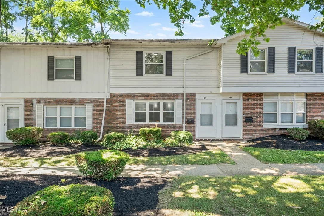 View of front of property with brick siding