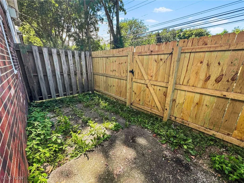 View of fenced backyard