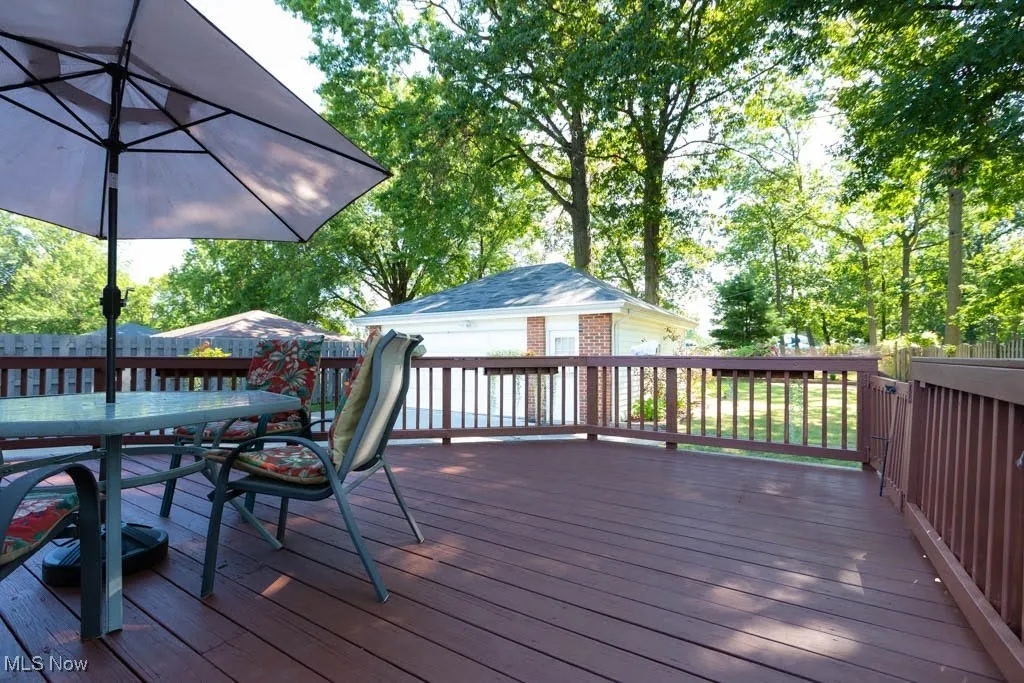 Wooden terrace featuring outdoor dining space