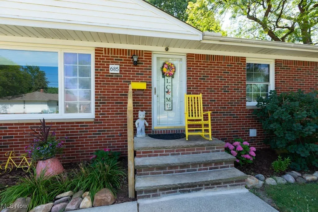 Property entrance with brick siding