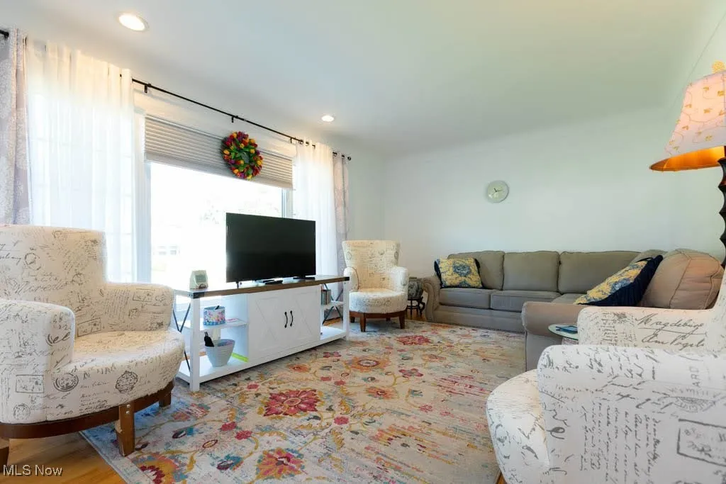 Living room featuring recessed lighting and light wood-style flooring
