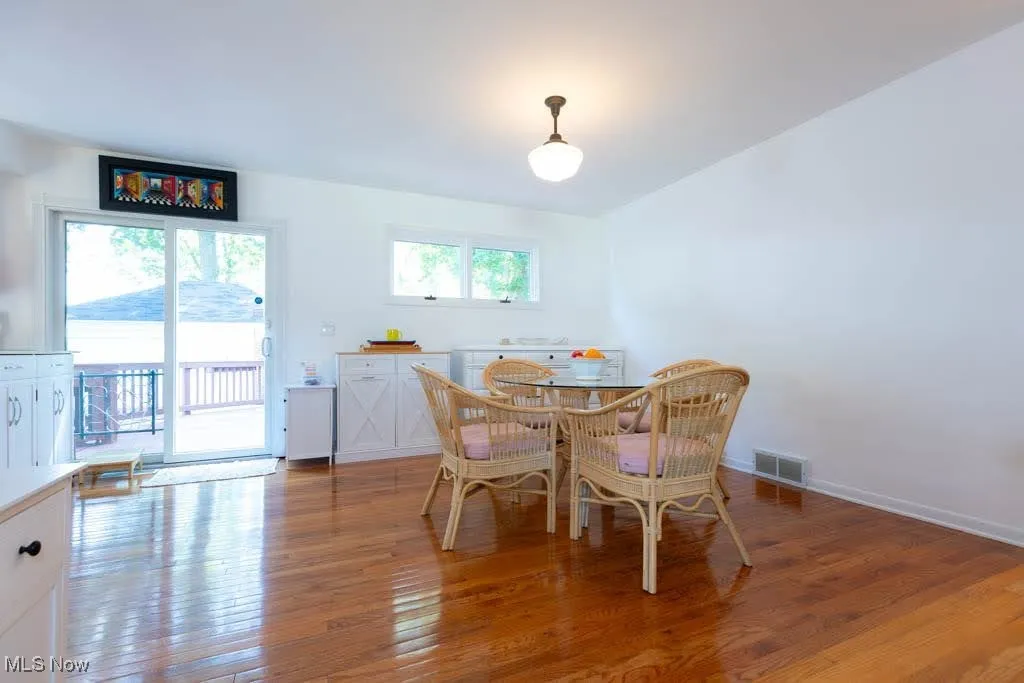 Dining area with light wood finished floors and baseboards