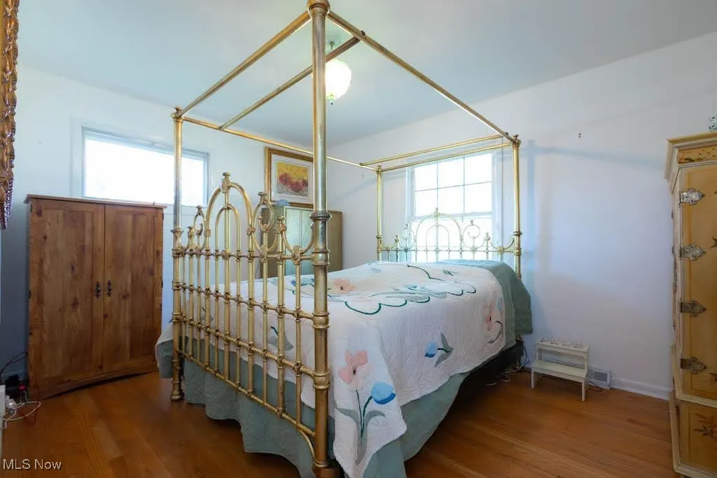 Bedroom with wood finished floors