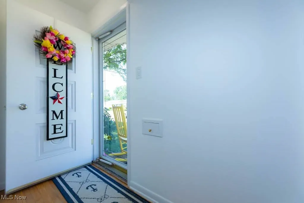 Entrance foyer with light wood finished floors