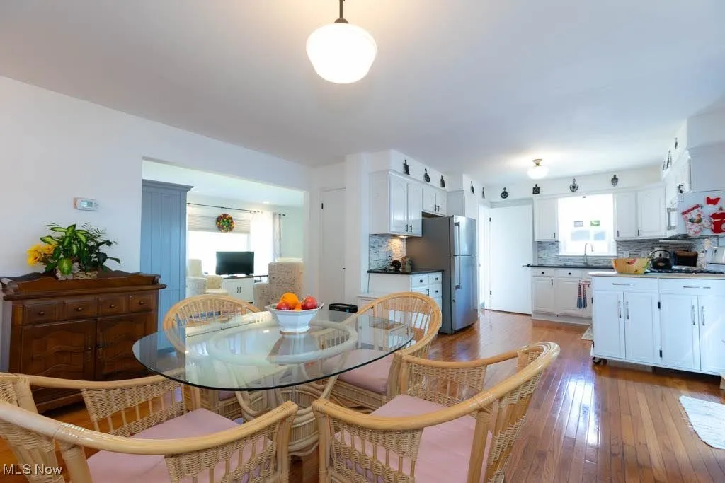 Dining space featuring wood-type flooring
