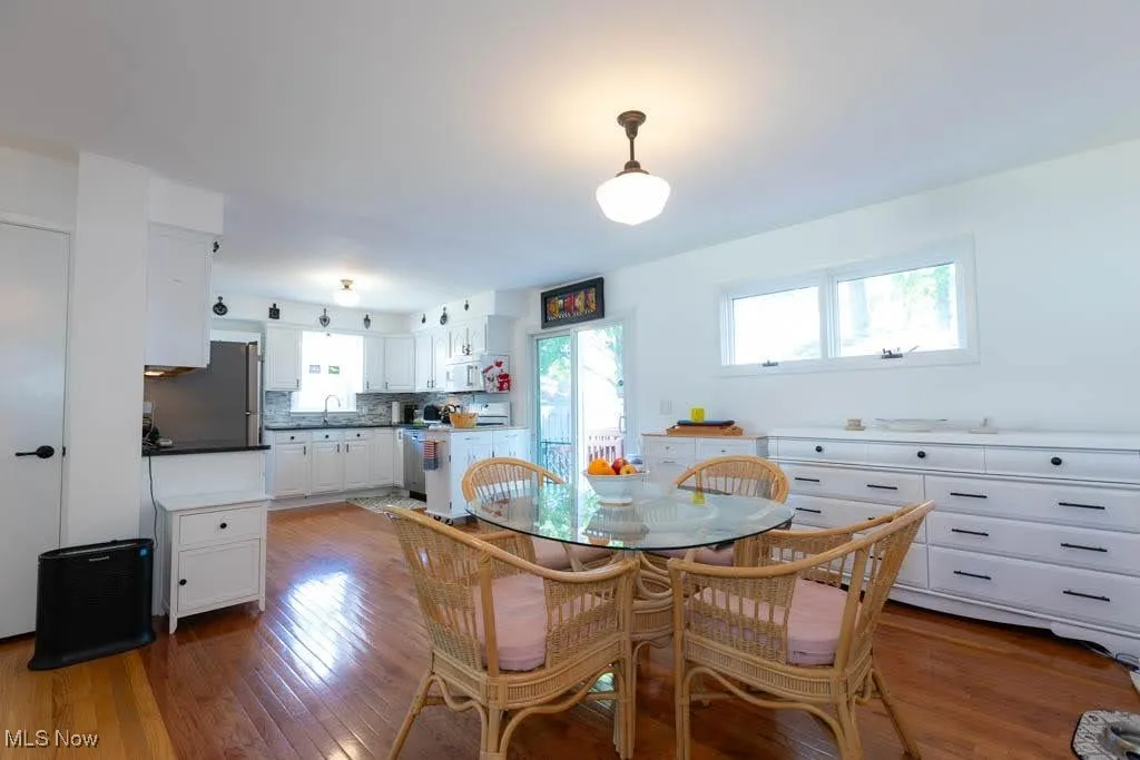 Dining area with wood finished floors