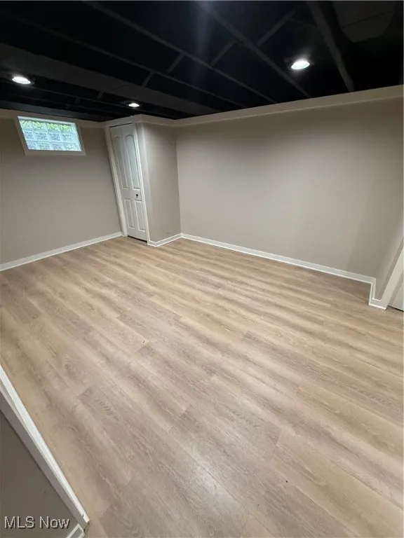 Basement featuring light wood finished floors