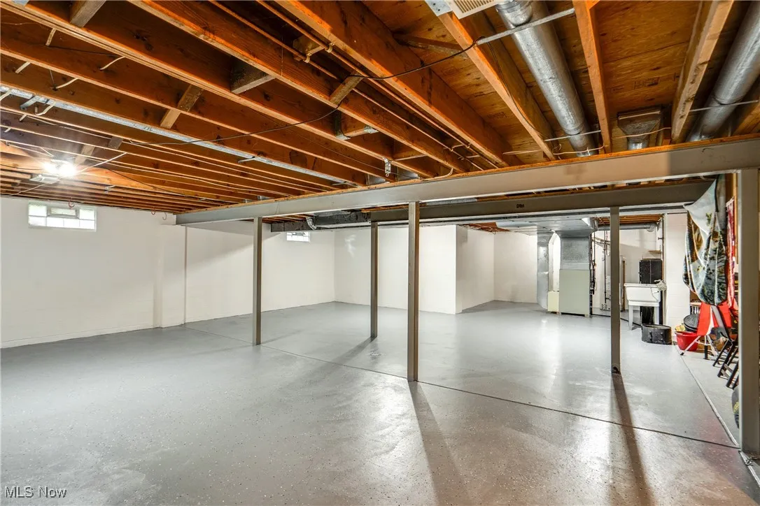 Basement featuring heating unit