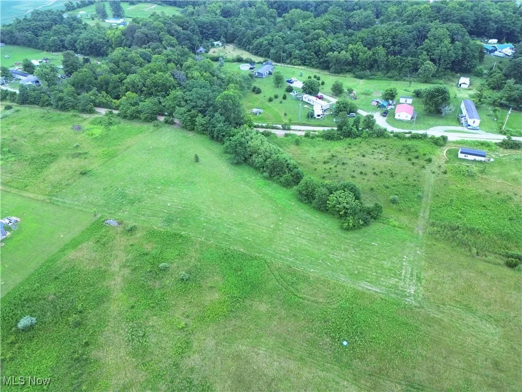 Aerial view of property and surrounding area with rural landscape