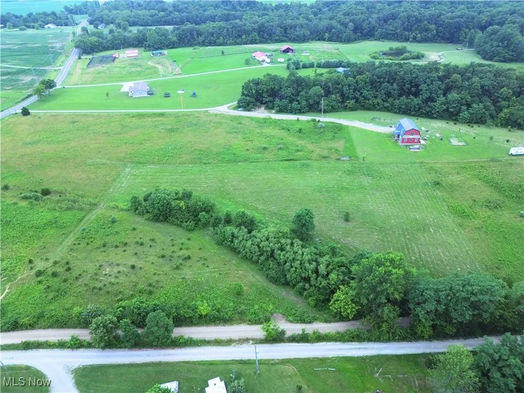 View of property location with rural landscape and a tree filled landscape