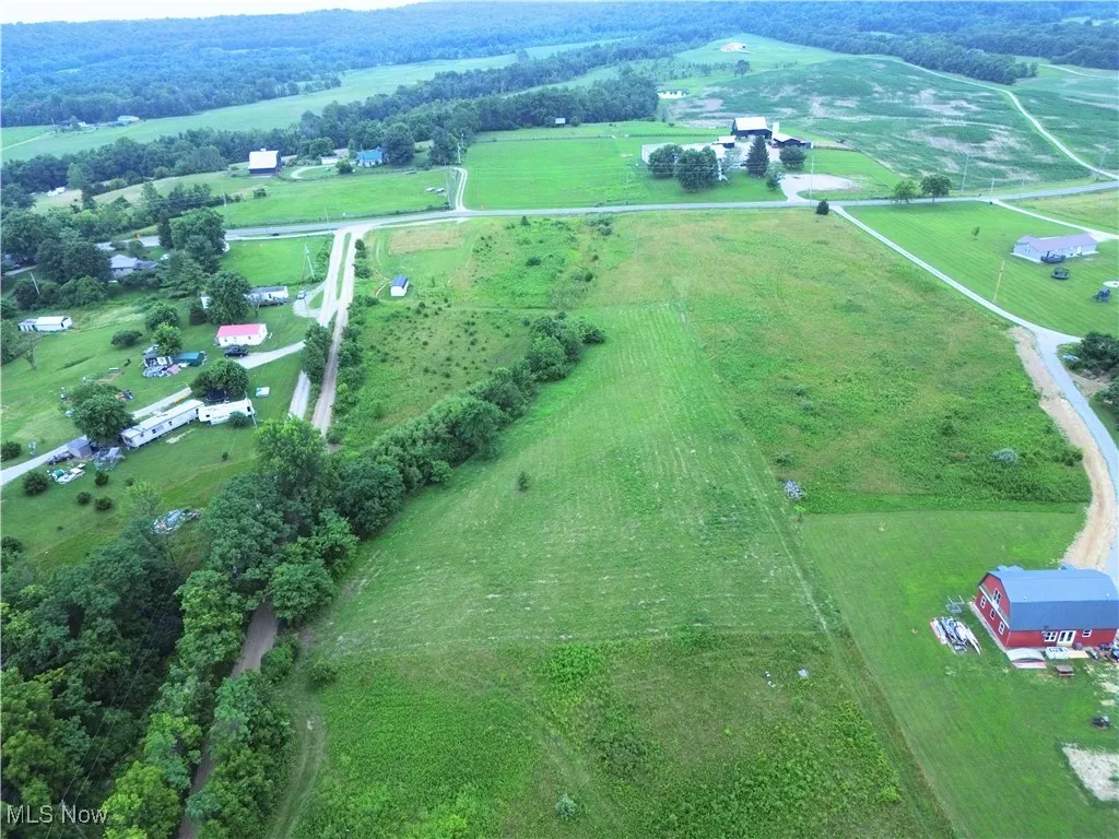 Aerial view of property's location featuring rural landscape and a pastoral area