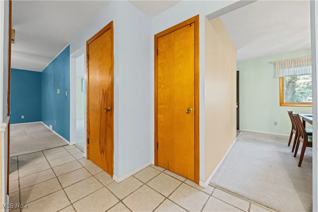 Hall featuring pantry and access to the basement