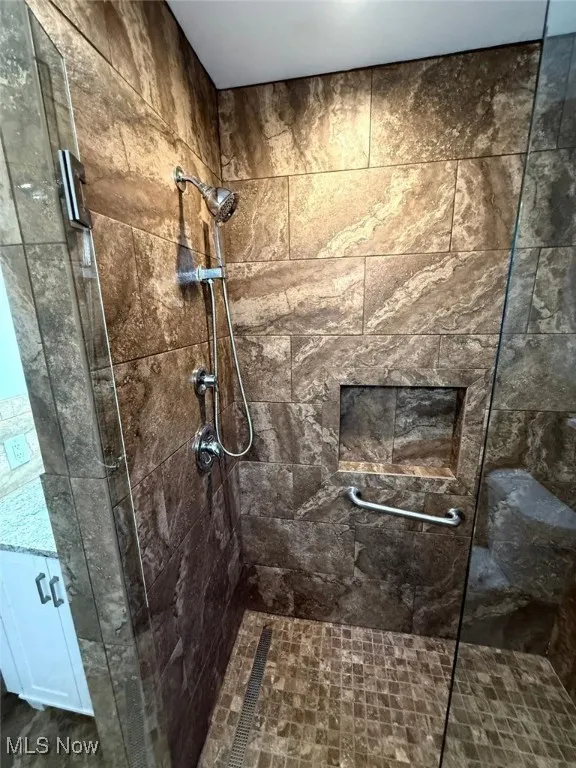 Bathroom featuring a shower stall