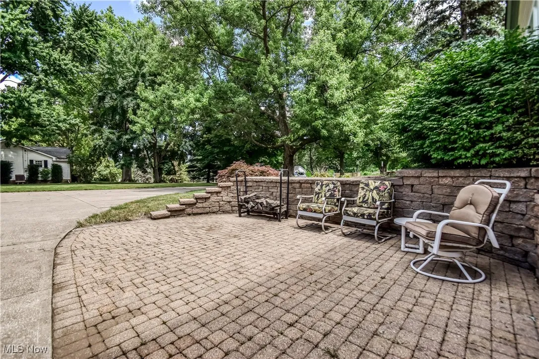View of patio featuring view of wooded area