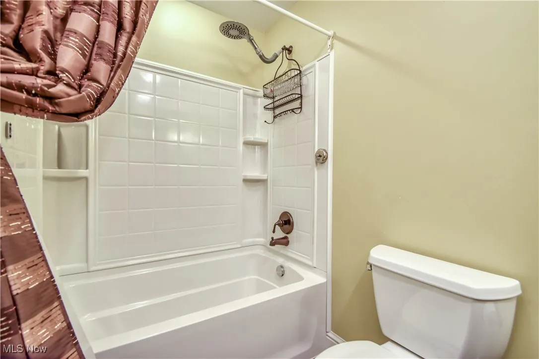 Full bathroom featuring toilet and bathtub / shower combination