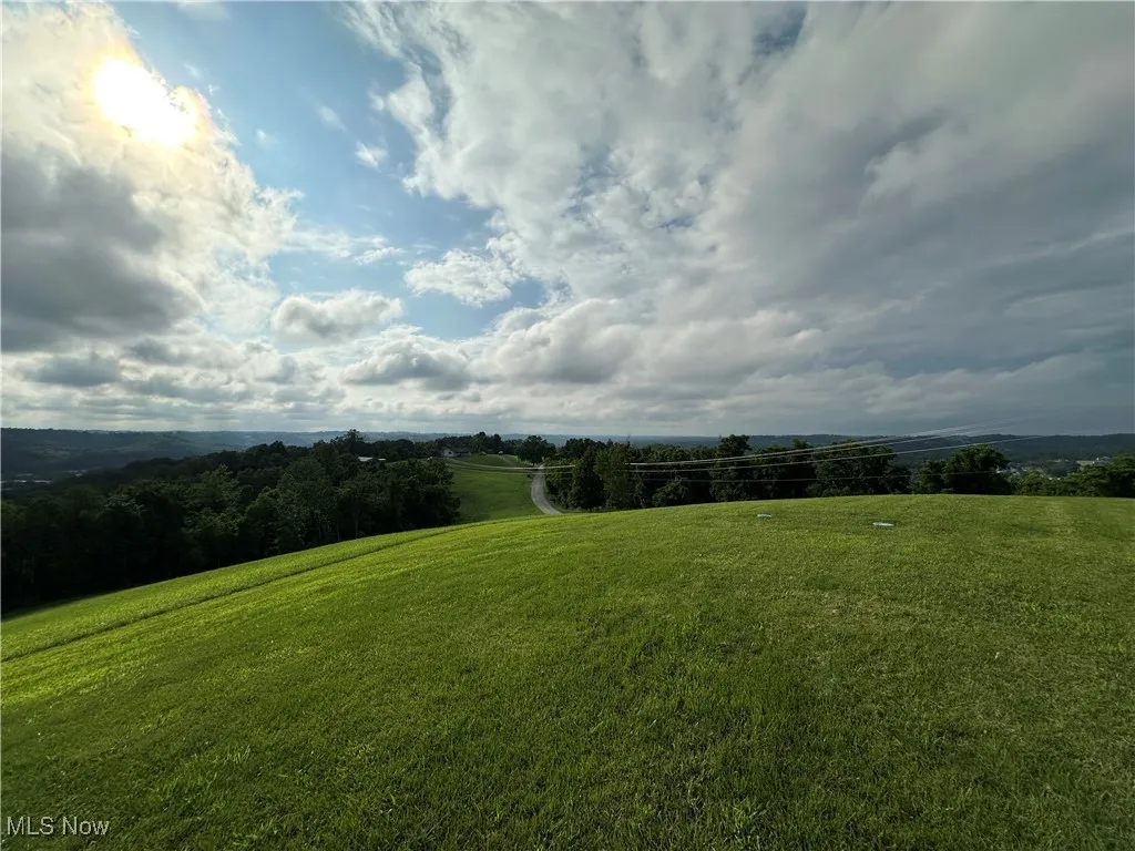 View of green lawn with a view of rural / pastoral area