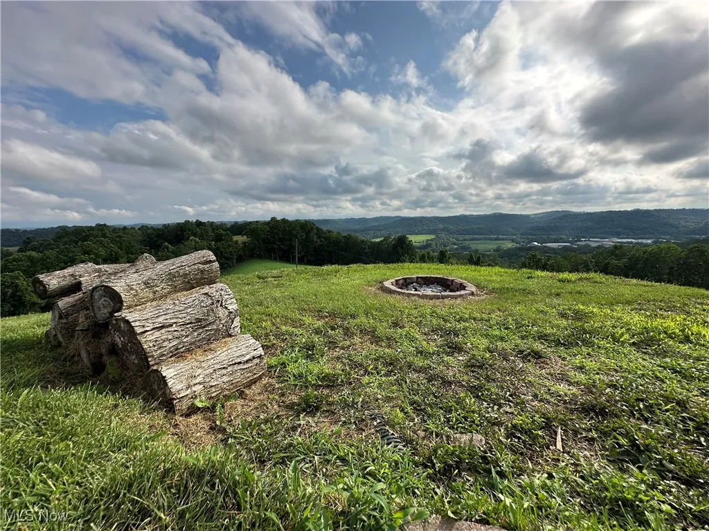 View of yard with a fire pit