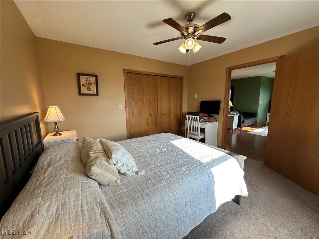 Bedroom featuring a closet and a ceiling fan