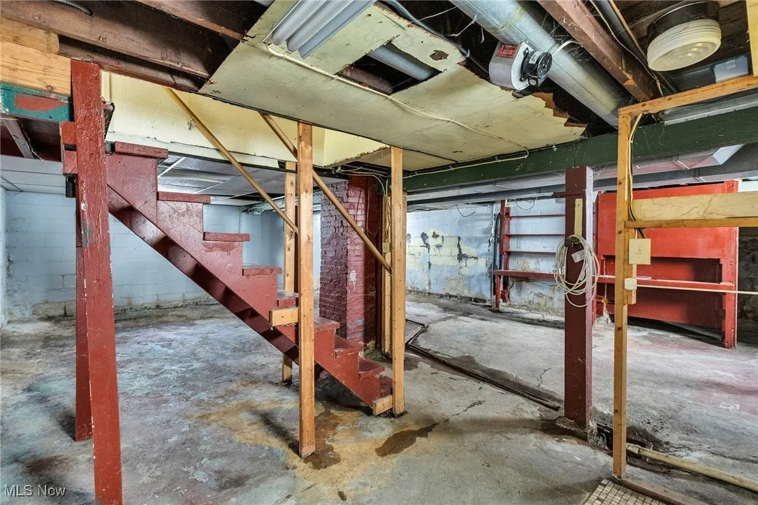 Unfinished basement with stairway