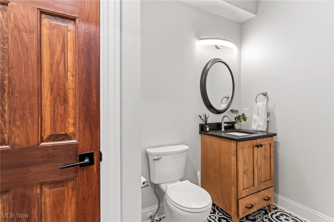 Bathroom featuring baseboards and vanity