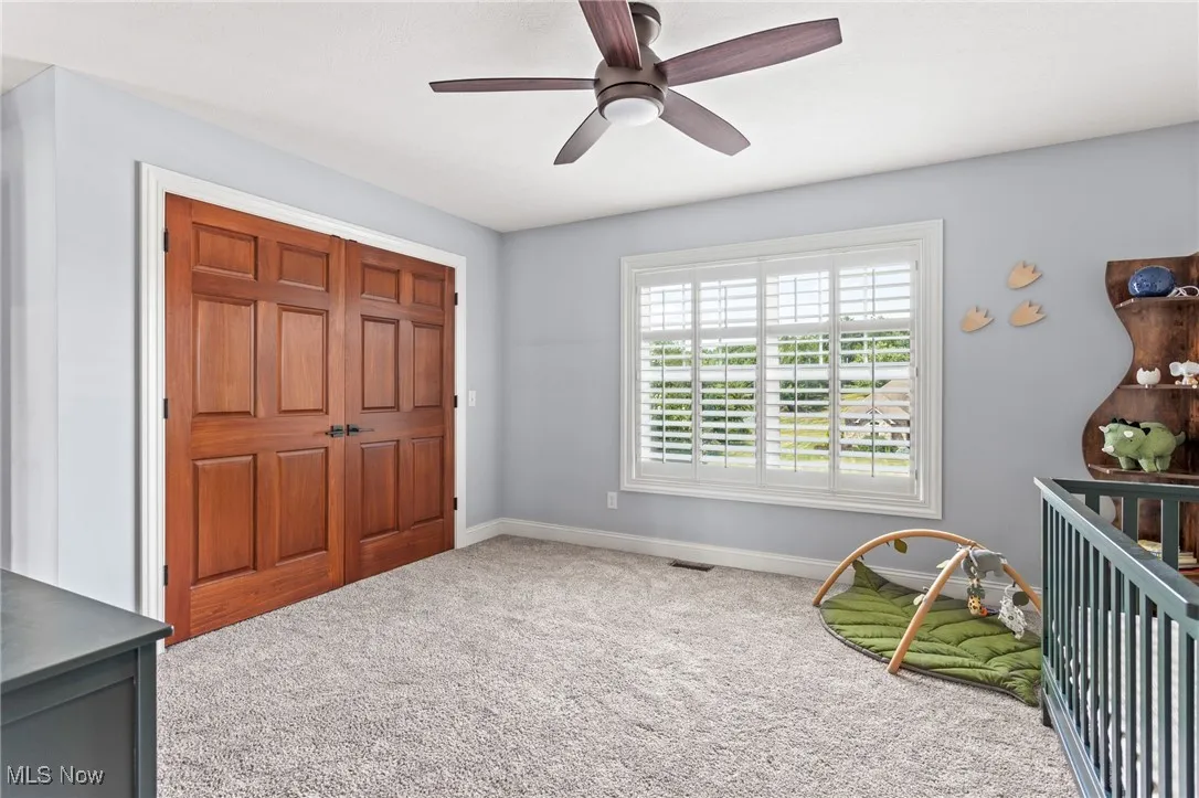 Bedroom featuring carpet flooring and a ceiling fan