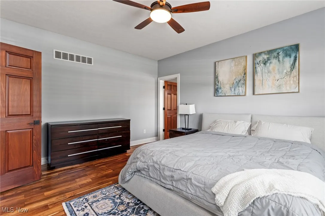 Bedroom with wood finished floors and ceiling fan
