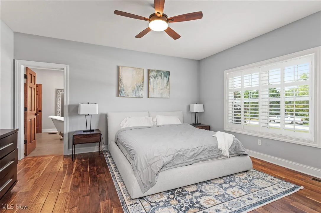 Bedroom with wood finished floors and ceiling fan