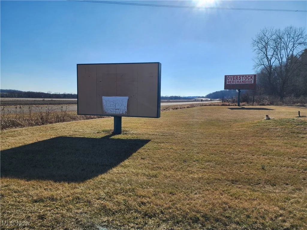 Community / neighborhood sign with a lawn