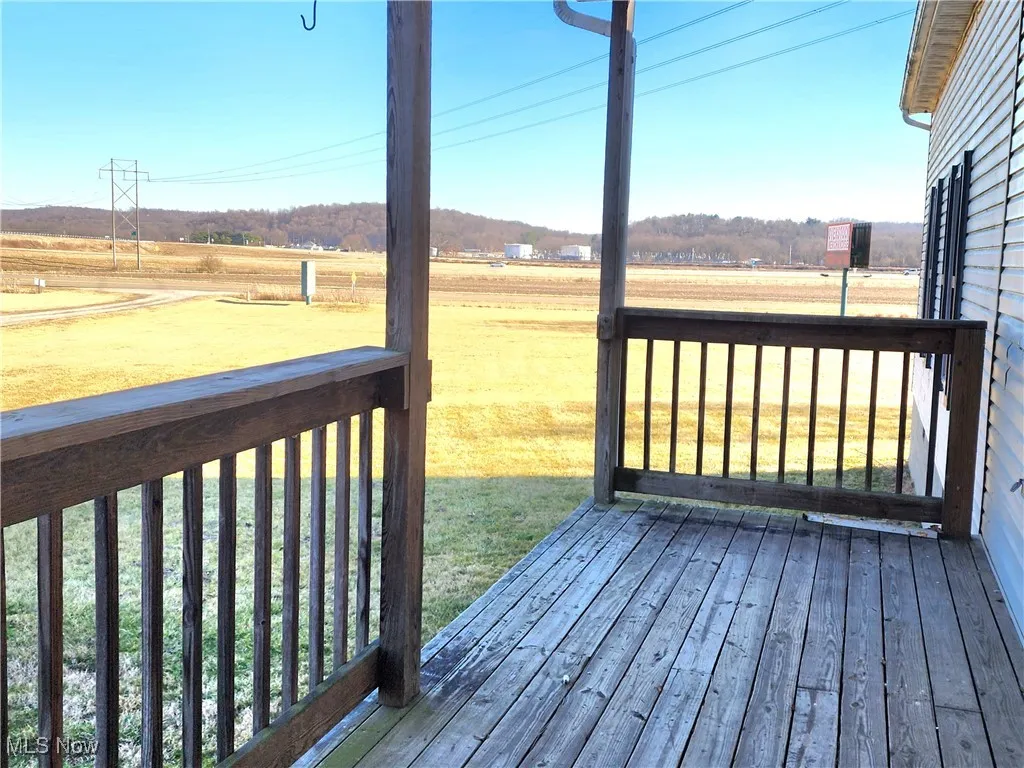 Wooden deck with a rural view