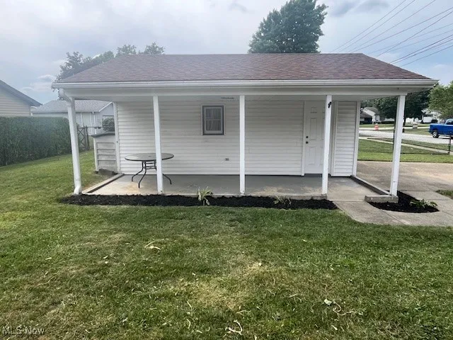View of outbuilding featuring a porch