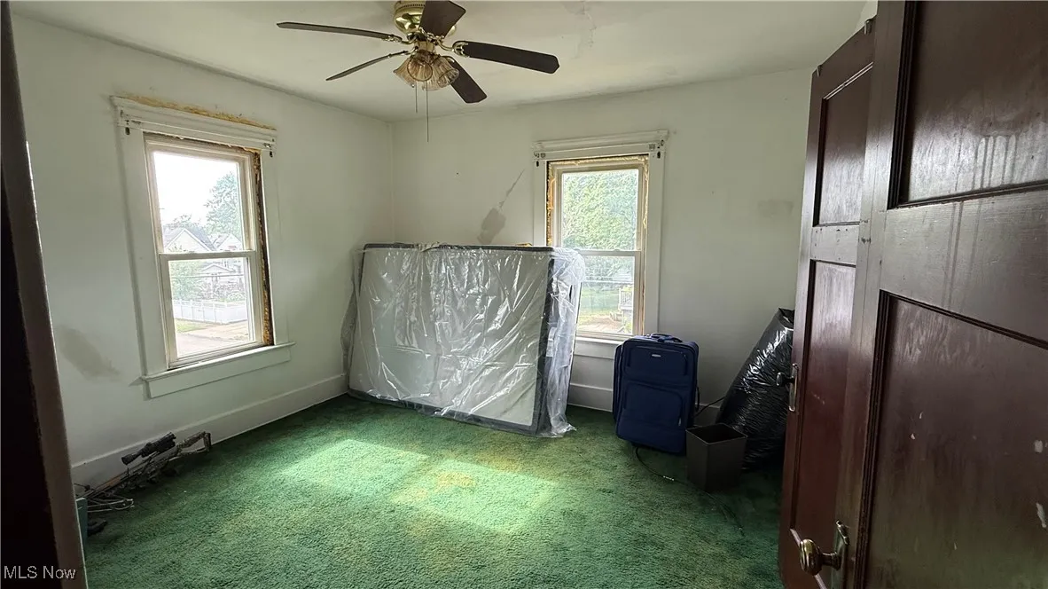 Bedroom 1 with ceiling fan and lots of  natural light