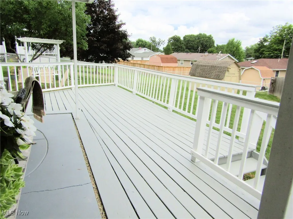 Wooden deck with a residential view